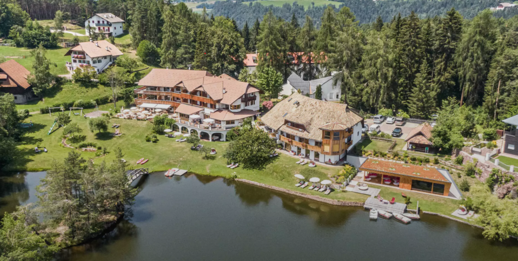 Aerial view of the Weihrerhof Hotel on Lake Wolfsgruben in South Tyrol