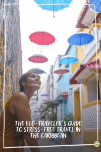 Woman looking up at colorful umbrellas hanging above a narrow street with buildings on both sides