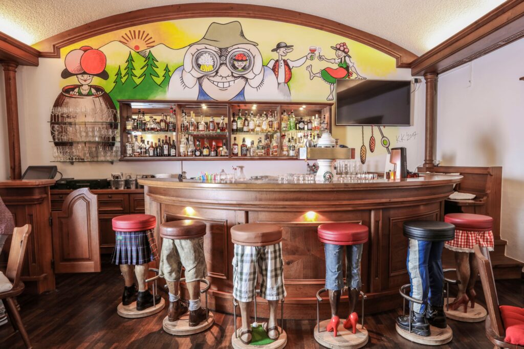 Fun Black Forest bar with bar stools shaped like pants