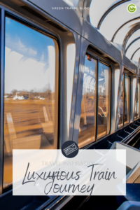 A view from inside a luxury train of the reflected windows and the passing landscape